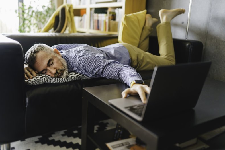 Man sleeping while trying to work