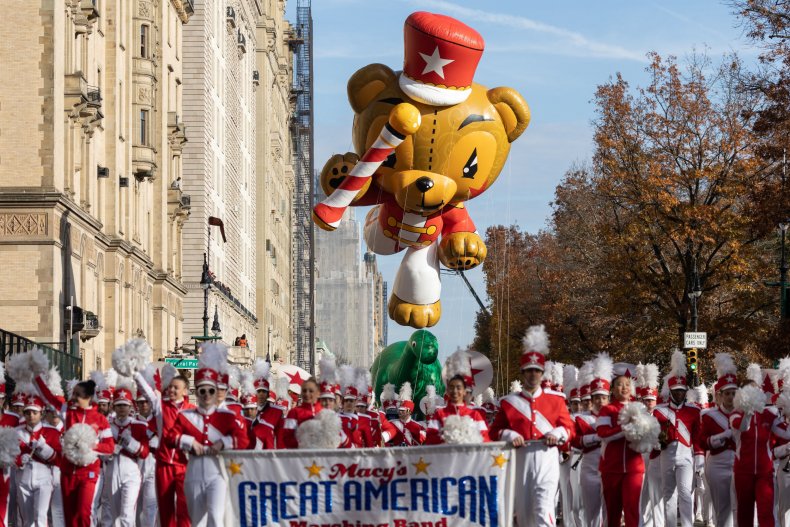 bear balloon hovers over band in parade