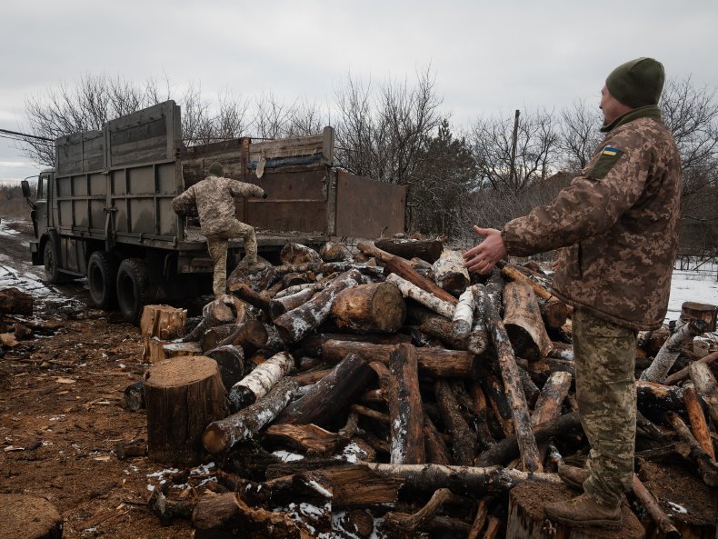 Ukrainian soldiers store wood