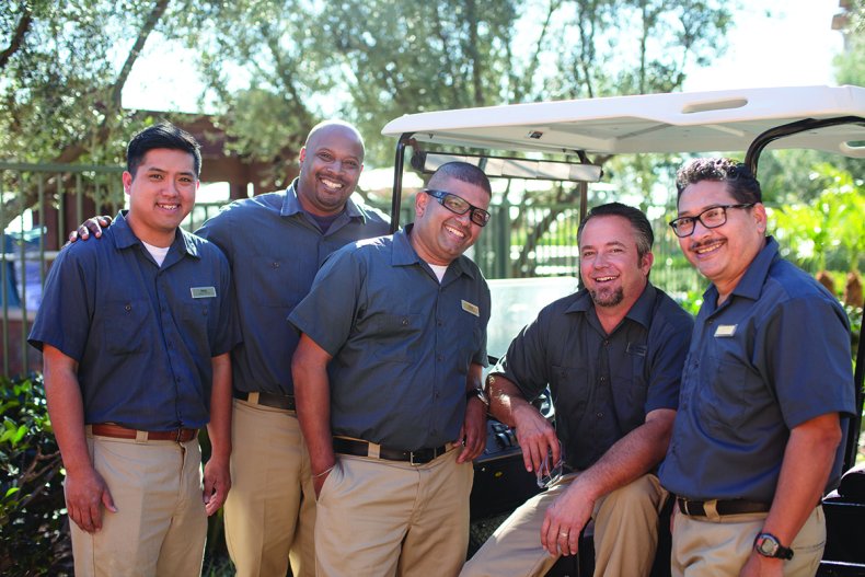 MVW engineering associates outdoors with green trees