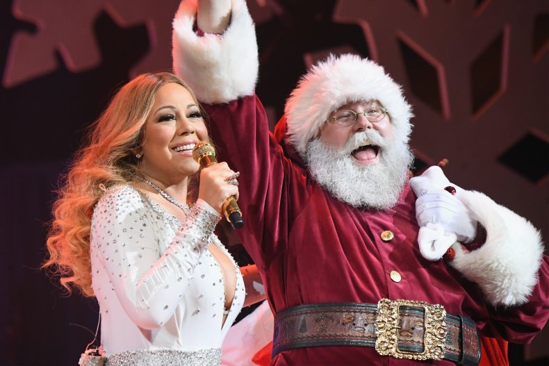 Mariah Carey performs alongside Santa Claus