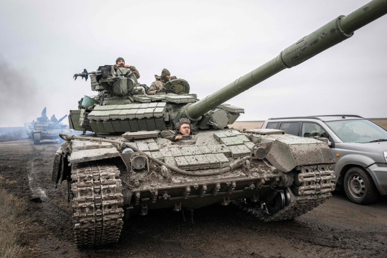 Ukrainian soldiers drive a tank