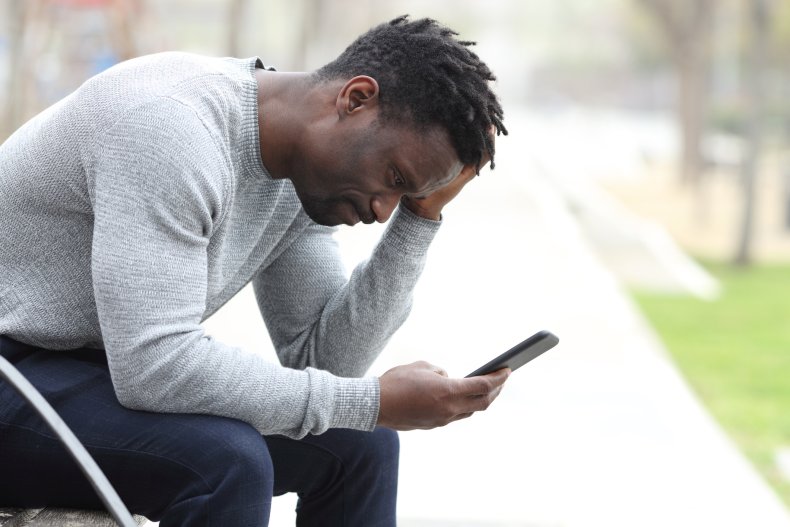 Man looking at ex on social media