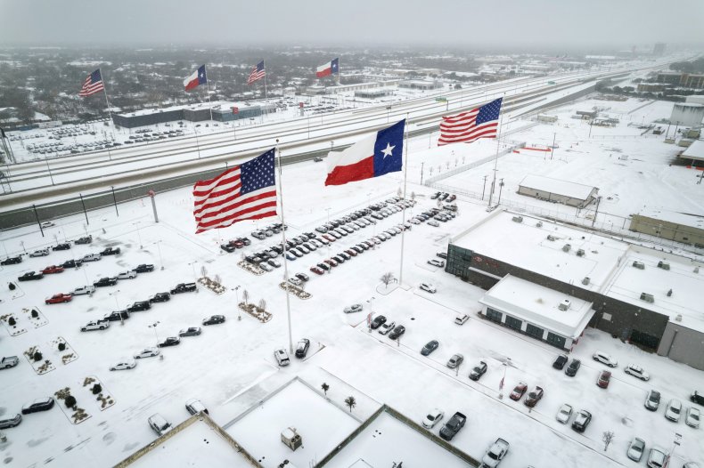 Texas and US flags in the snow