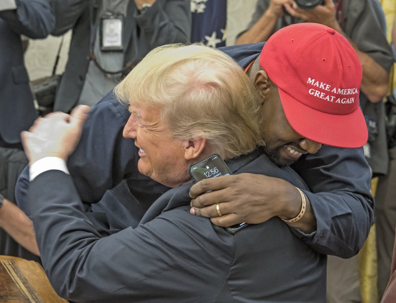 Kanye West and Donald Trump hug