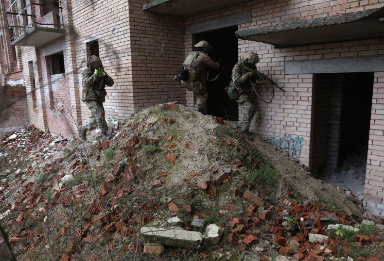 Ukrainian soldiers train in an abandoned building