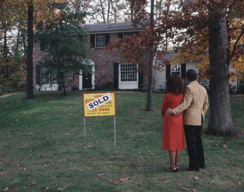 A couple inspects a house for sale