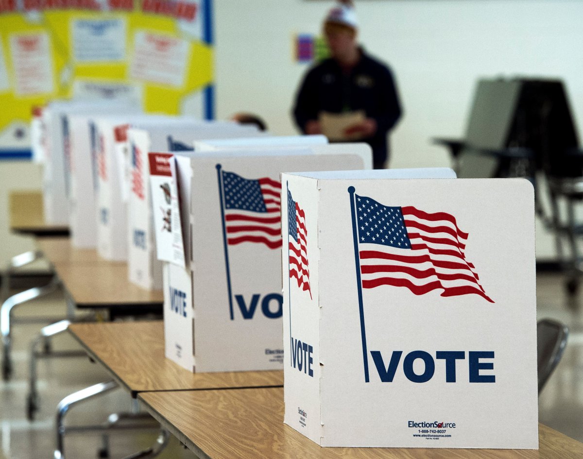 Man walks to use a voting booth
