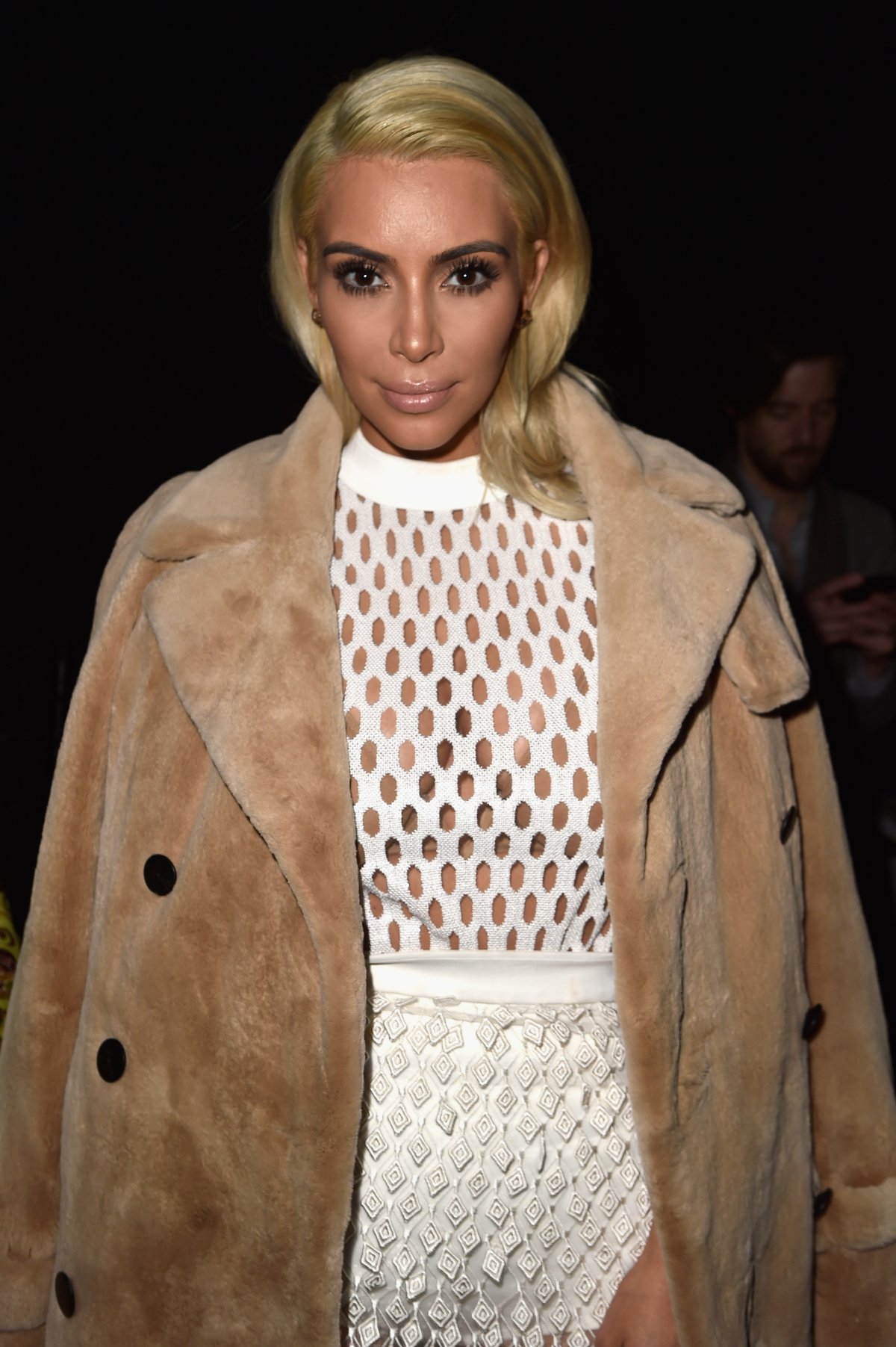 Kim Kardashian in white dress and blondehair