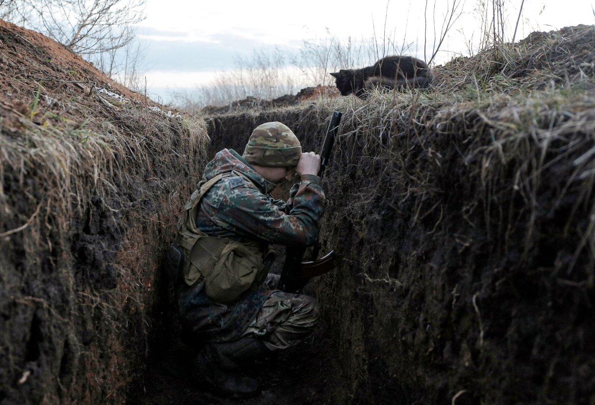 A Ukrainian soldier resting in a trench 