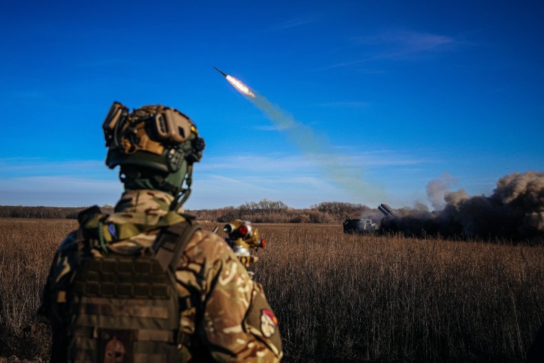 Ukraine soldier watching MLRS firing in east