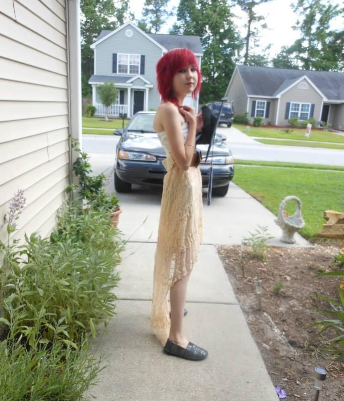 Teenage Lora Marsh in driveway