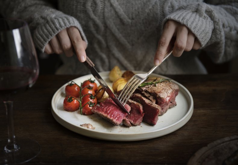Person eating meat