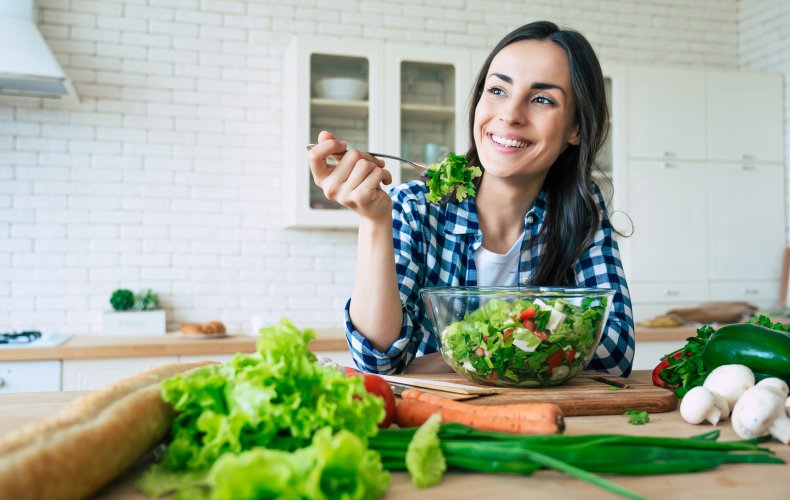 Woman eating vegetables