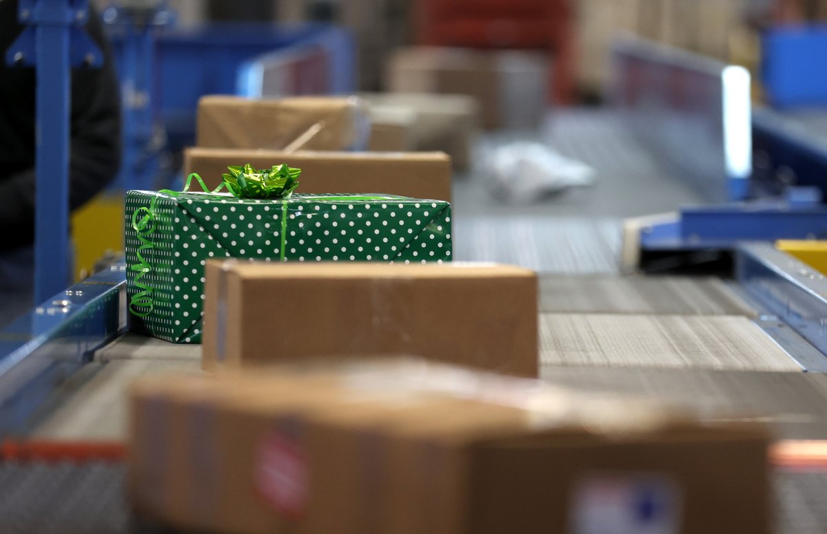 Holiday packages on belt at USPS center