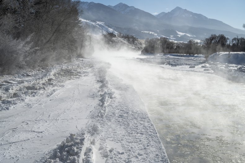 Mist Rises Above Ice At River
