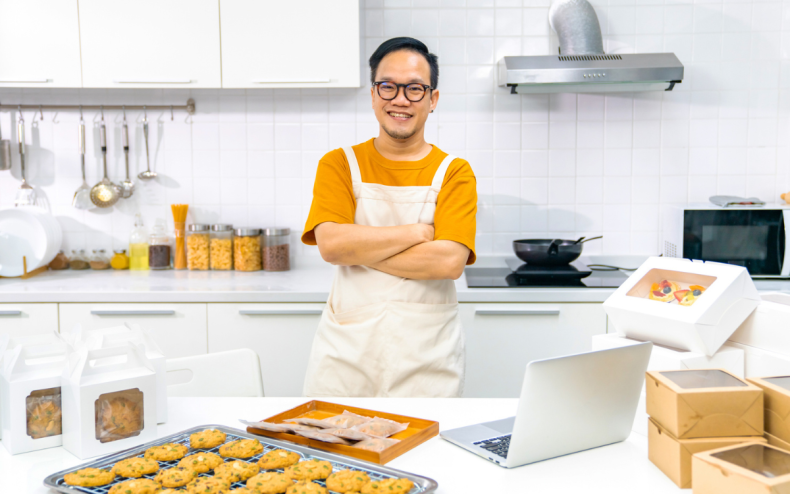 A man in front of some cookies.
