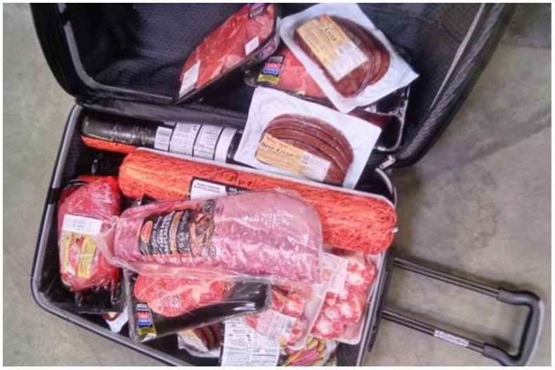 Photo of meat in a suitcase