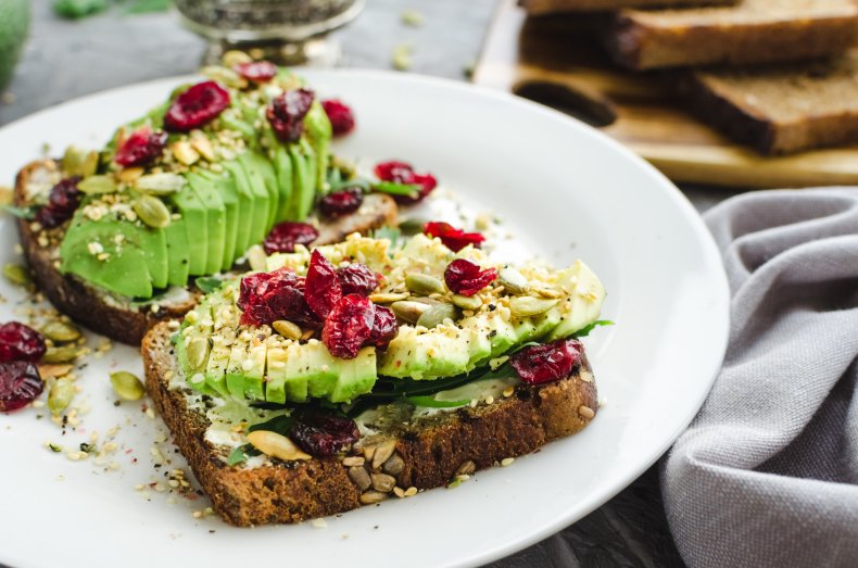 Avocado on toast with cranberries and seeds.