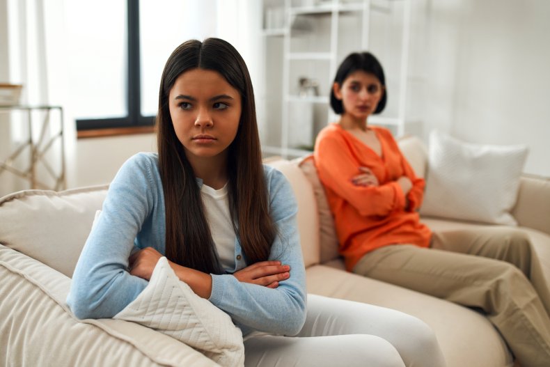 An angry teenage girl ignoring her mom