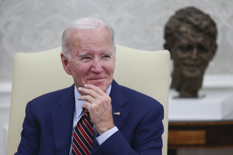 U.S. President Joe Biden listens to members