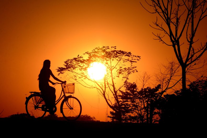 Indian girl rides a bicycle