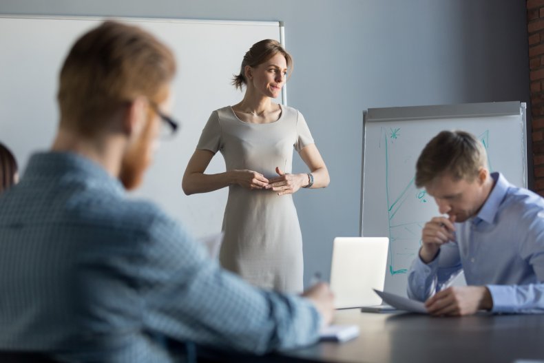 Worker looking uncomfortable in office.