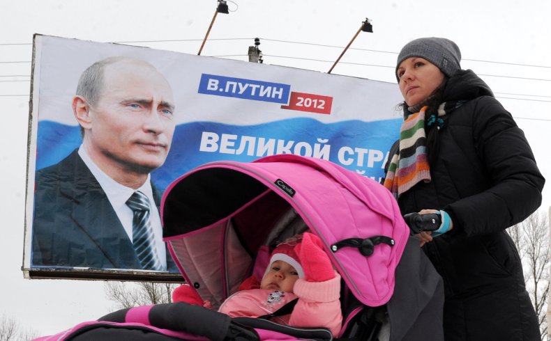 A mother pushes a stroller in Moscow