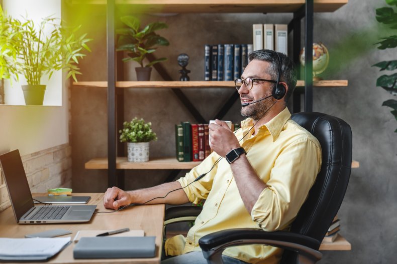 Man in home office work setting.