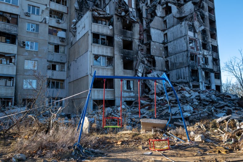 Destroyed building, swing set in Kharkiv 