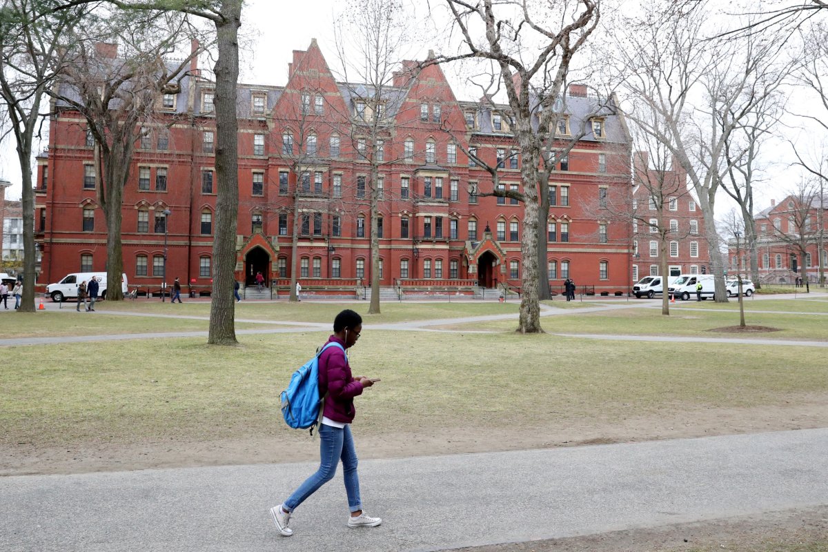 A student walks through Harvard Yard on