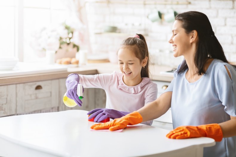 Girl helping mom clean
