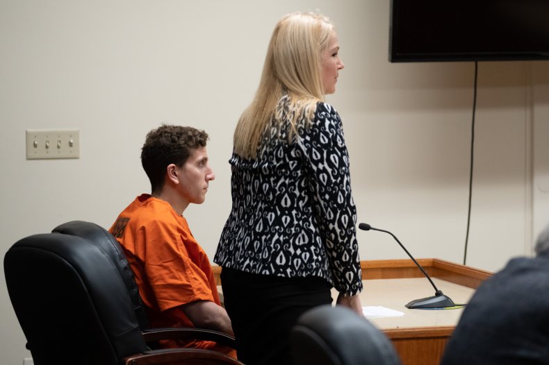 Bryan Kohberger sits as his attorney stands