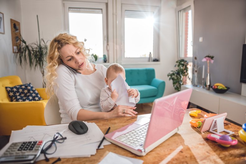 Busy working mom at home, taking calls.