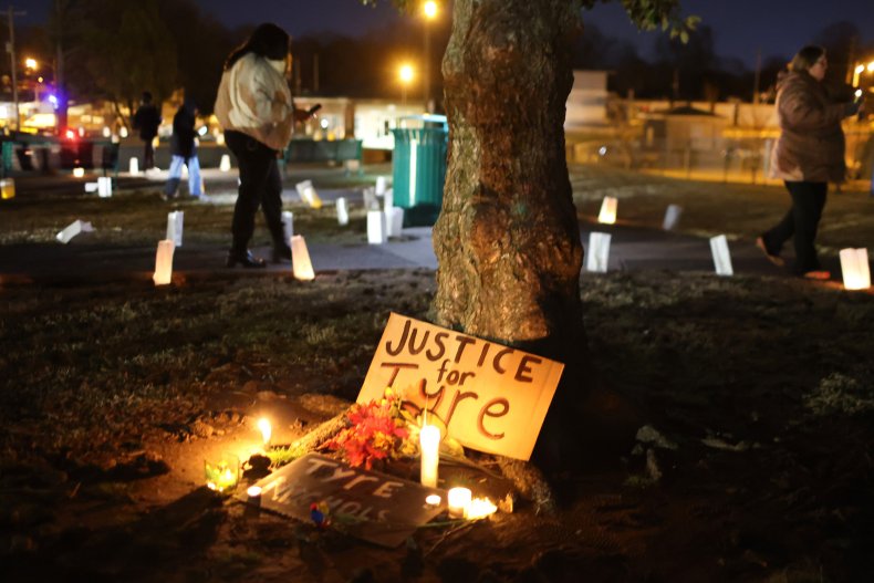 People attend a candlelight vigil