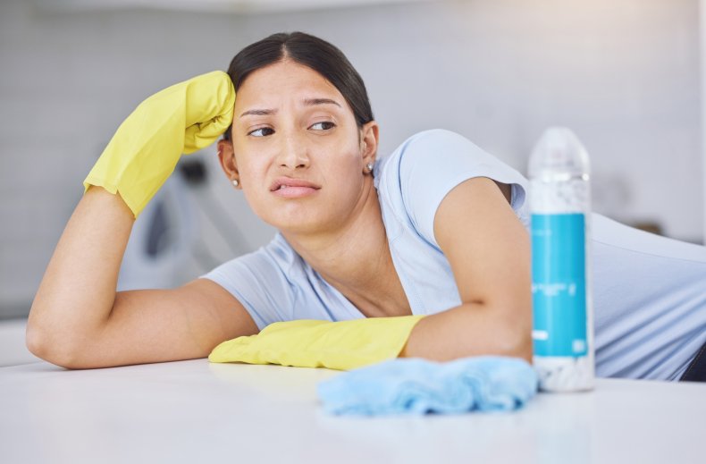 Annoyed woman cleaning