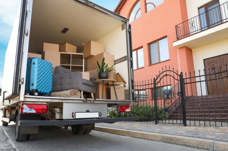 An open moving van full of boxes