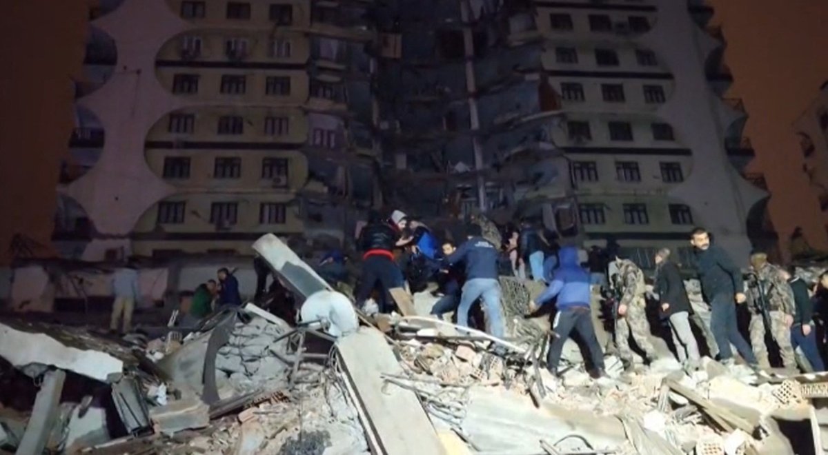 rescuers search rubble 