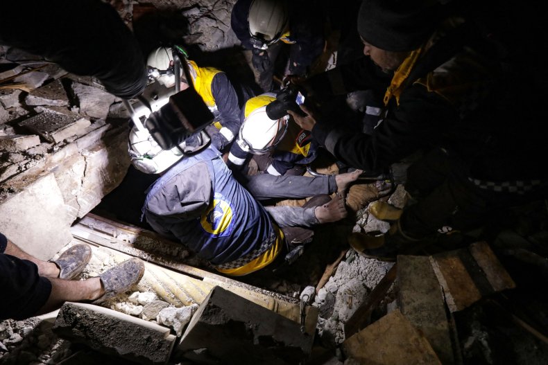 Syrian rescuers save a man after earthquake