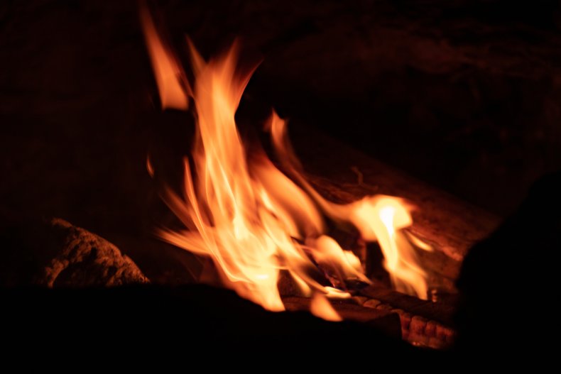 Flames rising from a campfire