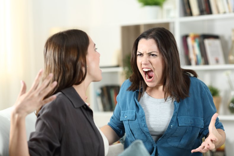 Two woman arguing on a sofa