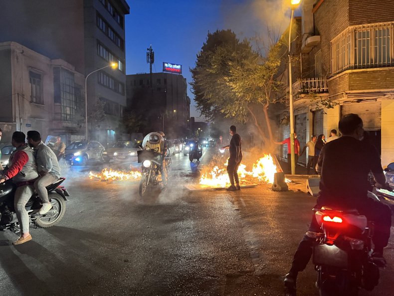 Iran, protesters, burn, objects, in, Tehran