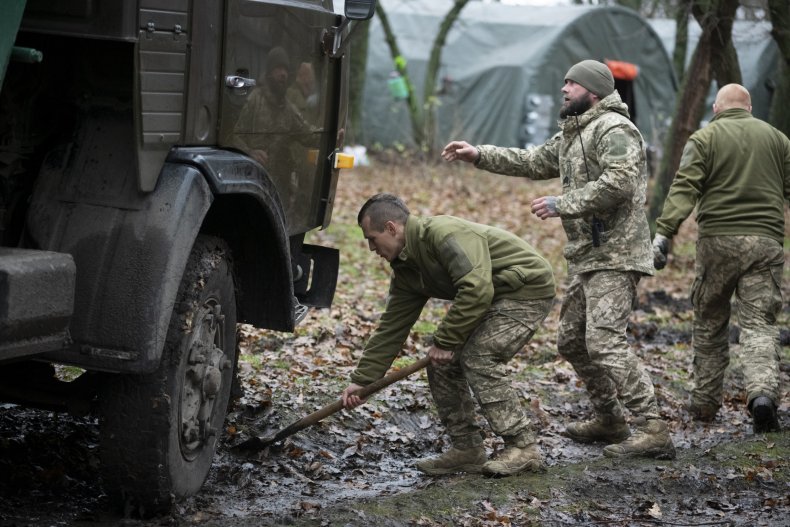 Ukrainian soldiers in mud