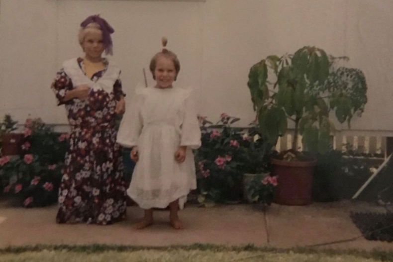 Weis as a child playing dress-up