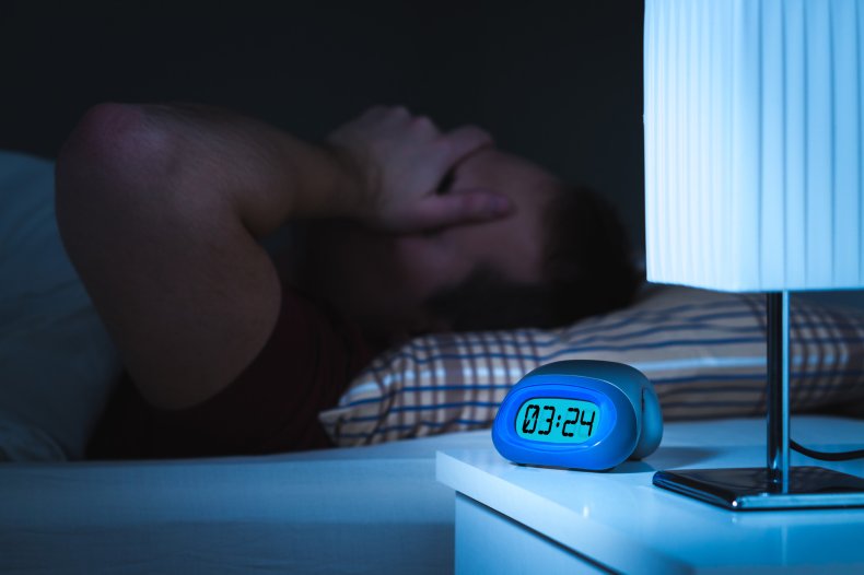 A man struggling to sleep