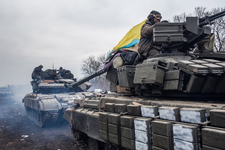 Ukrainian soldiers drive tanks
