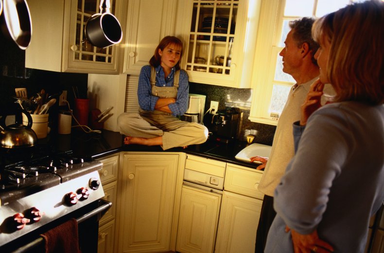 Parents having tense conversation with adult daughter