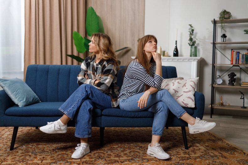 Step-mother and adult step-daughter ignoring each other