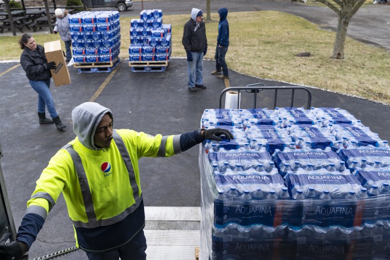 Dean Logan delivers bottled water