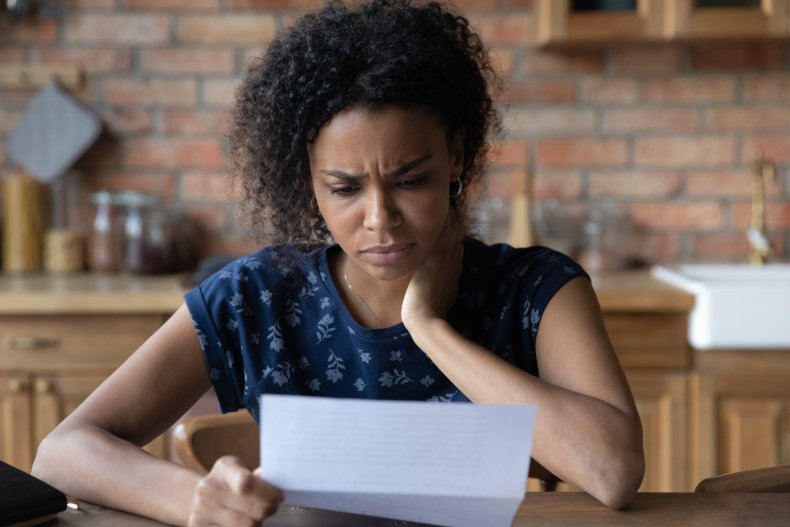 Concerned woman reading a letter